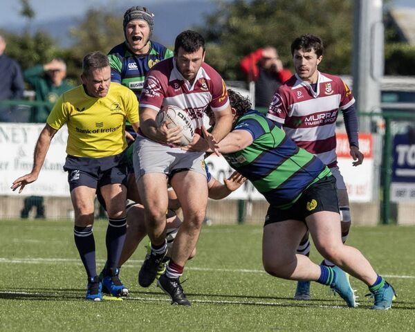 Tullow's Tom Cashen is tackled by Seapoint's Gordan Britchfield. Tullow's Tom Cashen is tackled by Seapoint's Gordan Britchfield.
