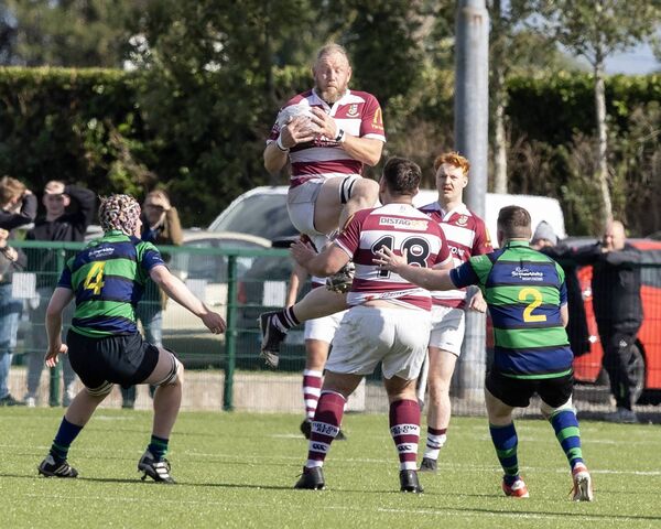 Tullow's Joe Waters wins this aerial battle with Seapoint's Hugh Ross. Tullow's Joe Waters wins this aerial battle with Seapoint's Hugh Ross.