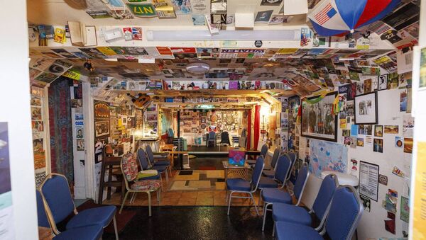 The walls are of the club are covered in paintings, photographs, programmes of past performances and mementos The walls are of the club are covered in paintings, photographs, programmes of past performances and mementos