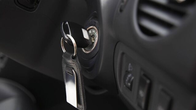 Car ignition with key, close-up <p>Car ignition with key, close-up</p>