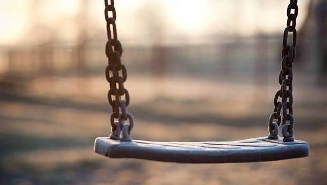 Carlow man sat on swing in local playground smoking cannabis joint Carlow man sat on swing in local playground smoking cannabis joint