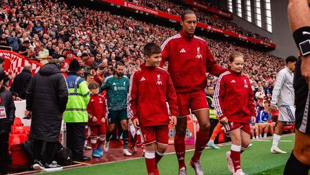 Liverpool fan Max leads team onto pitch at Anfield Liverpool fan Max leads team onto pitch at Anfield